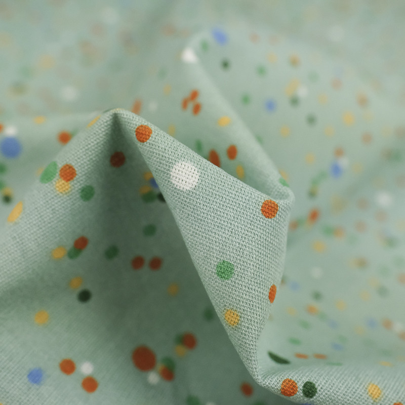 Coton imprimé pois multicolore fond vert sauge - 10cm