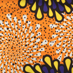Tissu africain motif fleur graphique violet jaune fond orange
