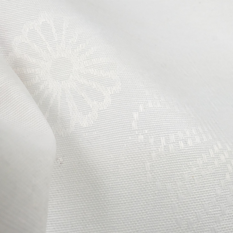 Tissu enduit motif floral ton sur ton blanc