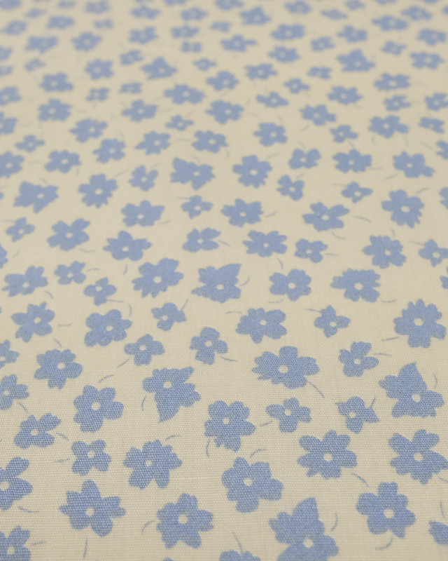Coton imprimé fleur bleu ciel fond crème - Mercerine