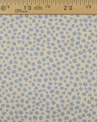 Coton imprimé fleur bleu ciel fond crème - Mercerine