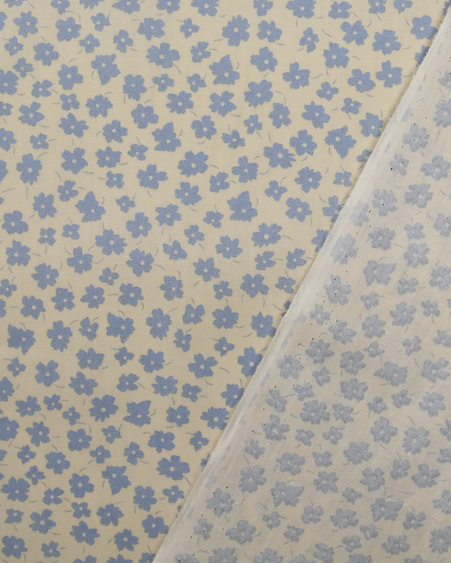 Coton imprimé fleur bleu ciel fond crème - Mercerine