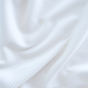 Tissu Jersey matelassé blanc