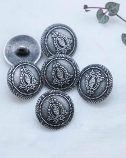Bouton fantaisie à coudre : écusson zamak gris mat à pied - Mercerine