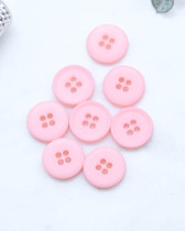 Bouton polyester plat 4 trous mat rose 11mm