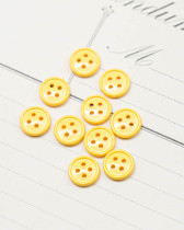Bouton nylon plat 4 trous jaune 10mm