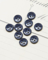 Bouton nylon plat 4 trous bleu 10mm