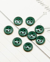 Bouton nylon plat 4 trous vert 10mm