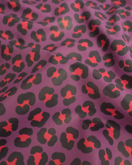 Tissu Imperméable Léopard Mauve et Rouge - Mercerine