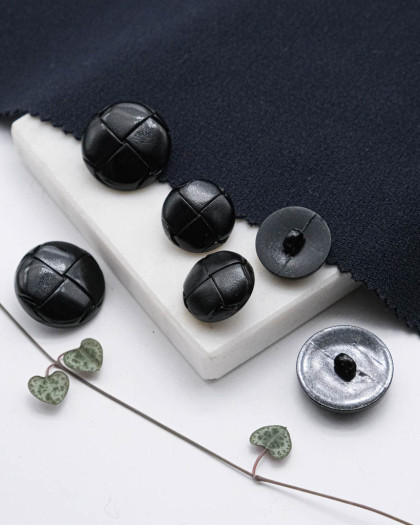 Bouton à pied imitation cuir tressé noir