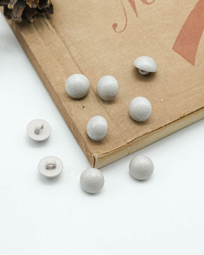 Bouton fantaisie à coudre : rond et bombé scintillant gris à pied - Mercerine