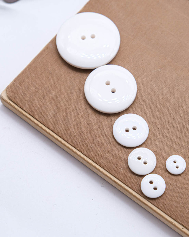 Bouton à coudre : blanc brillant 2 trous - Mercerine