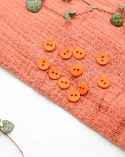 Bouton polyester mat 2 trous orange 12mm - Mercerine