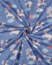 Popeline de Coton Motif Licorne Fond Bleu