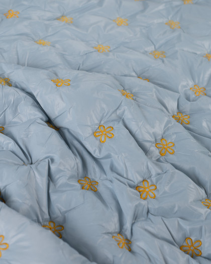 Tissu Matelassé Petites Fleurs Brodées Bleu - Mercerine