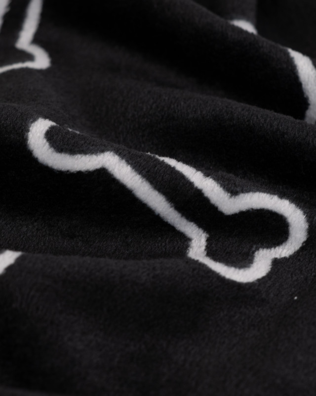 Tissu Polaire Motif Os de Chien Fond Noir - Mercerine