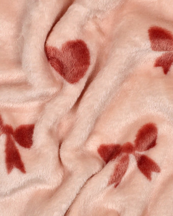 Tissu Doudou Motif Nœud et Cœur Fond Rose - Mercerine