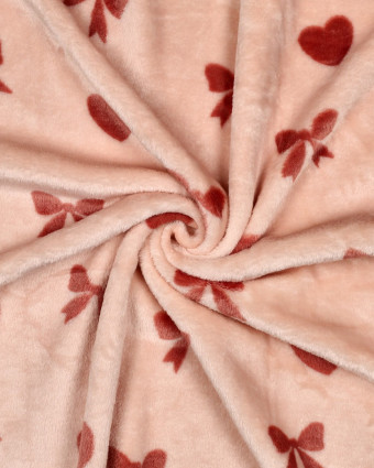 Tissu Doudou Motif Nœud et Cœur Fond Rose - Mercerine
