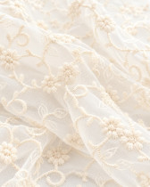 Dentelle sur tulle fleuri écru