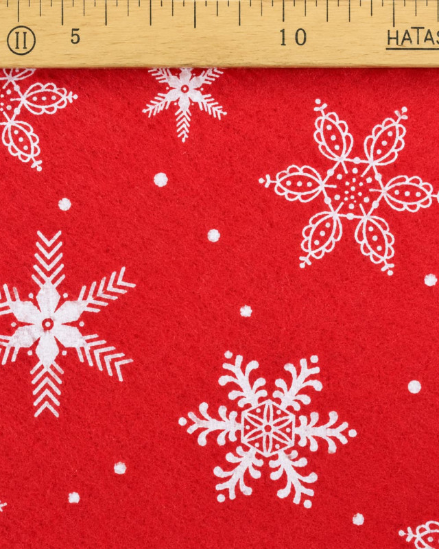 Feutrine rouge flocons blancs – Tissu de Noël | Mercerine