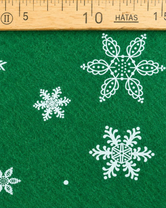 Feutrine verte flocons blancs – Tissu Noël | Mercerine