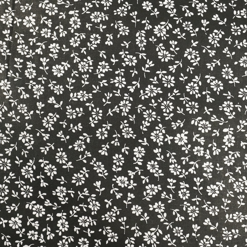 Coton imprimé fleurs blanches sur fond noir -Mercerine